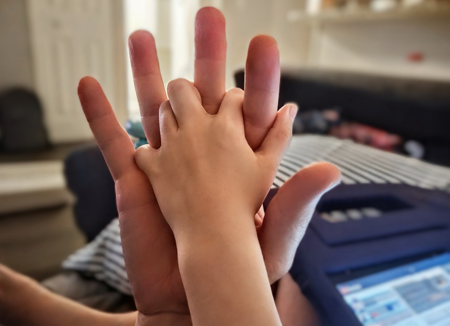 Father and child holding hands
